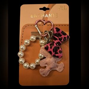 Enchanté Bag Charm with Pink Leopard Bow. Teddy Bear and Pearl Bracelet.